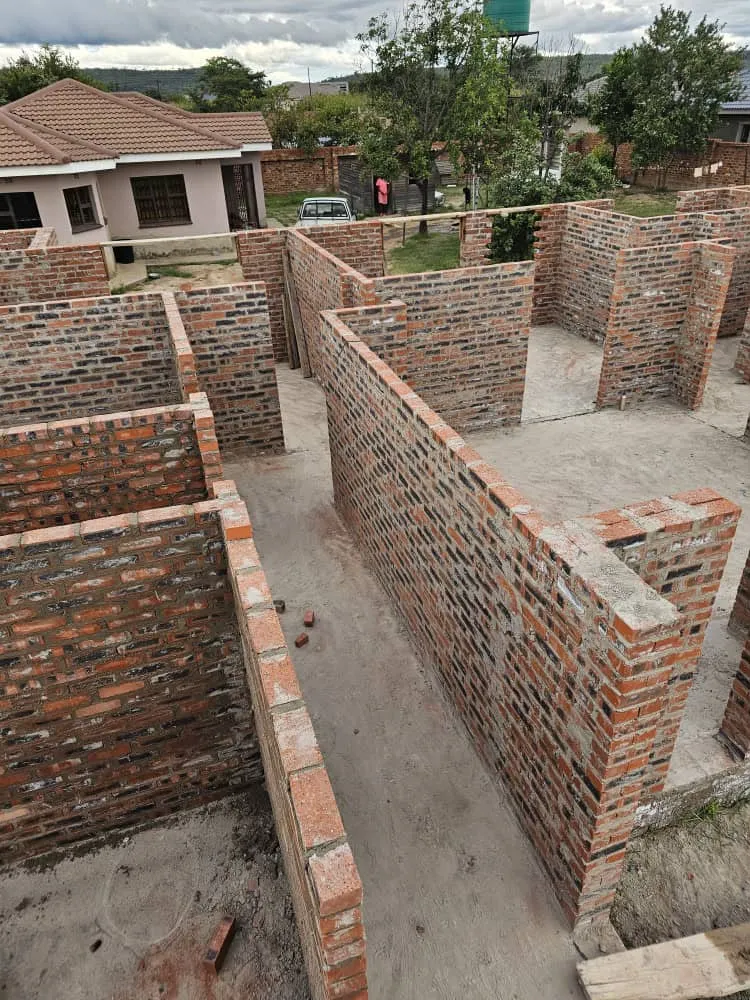 Brick walls forming the rooms of a residential building under construction