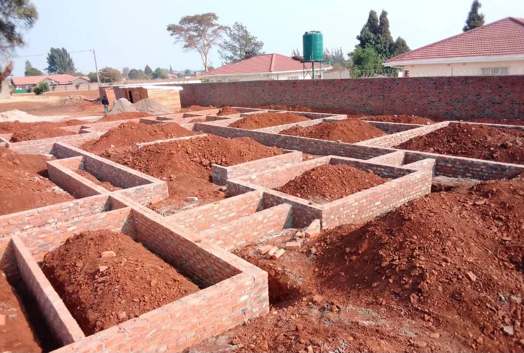 Brick foundation walls laid out across a residential site